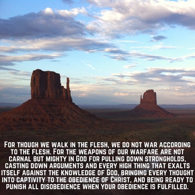 Red sandstone buttes at dusk, with the words of 2 Corinthians 10:3–6