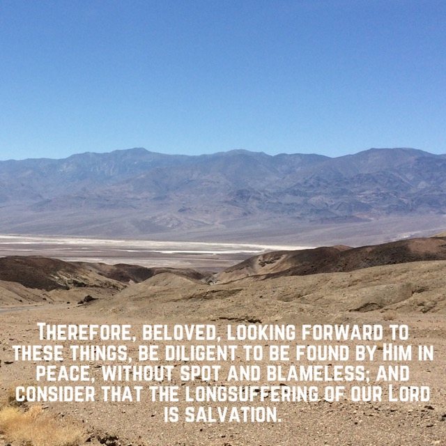 Desert valley below bare mountains, with the words of 2 Peter 3:14–15