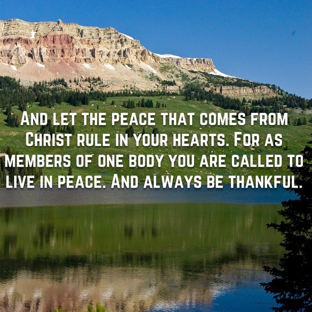 A plateau mountain reflected in a lake, with the words of Colossians 3:15