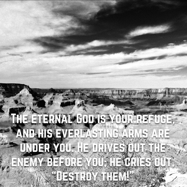 A vast canyon in black and white, with the words of Deuteronomy 33:27