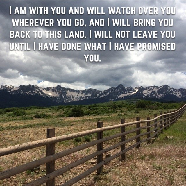 A split-rail fence toward a snowy mountain range, with the words of Genesis 28:15