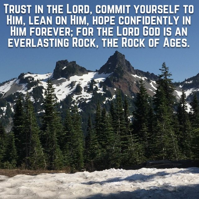 Rocky peaks above evergreens and snow, with the words of Isaiah 26:4