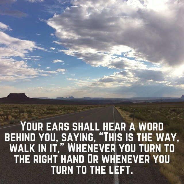 A desert highway under towering clouds, with the words of Isaiah 30:21