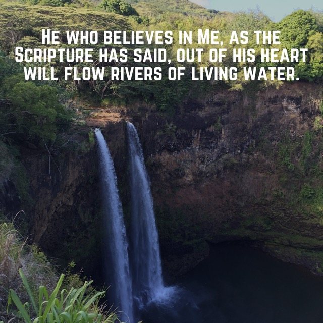 Twin waterfalls in a green canyon, with the words of John 7:38