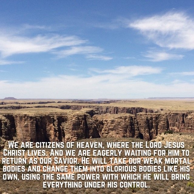 A deep canyon across a high desert plateau, with the words of Philippians 3:20–21