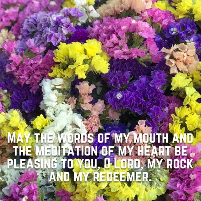A bouquet of bright statice flowers, with the words of Psalm 19:14