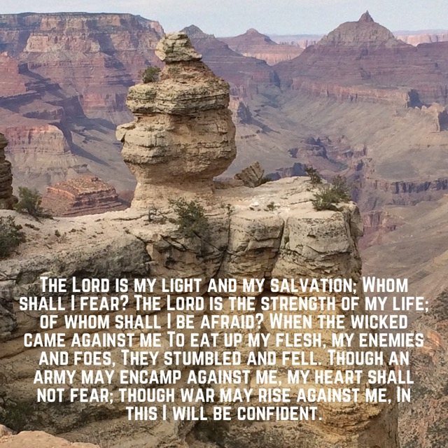 A rock pinnacle over a deep canyon, with the words of Psalm 27:1–3