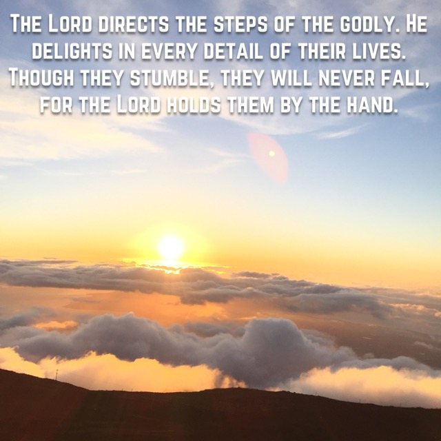 The sun rising above a sea of clouds, with the words of Psalm 37:23–24