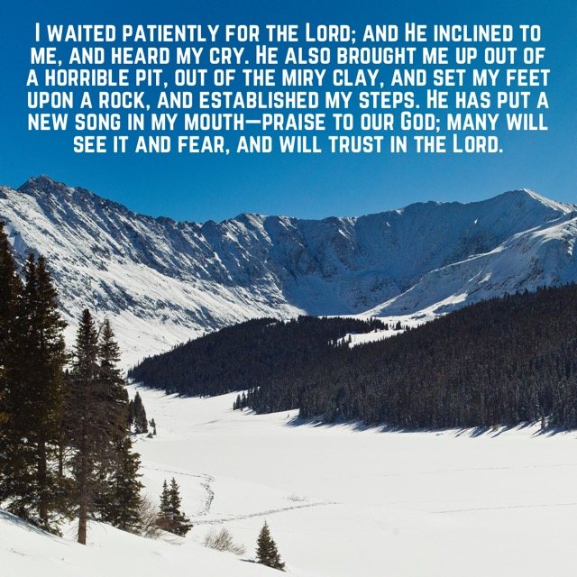 Snowy alpine valley and peaks, with the words of Psalm 40:1–3
