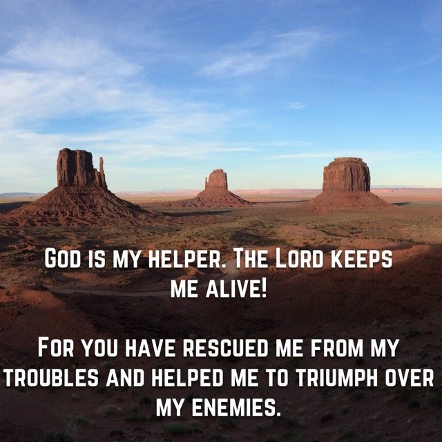 Red rock buttes across a desert valley, with the words of Psalm 54:4, 7