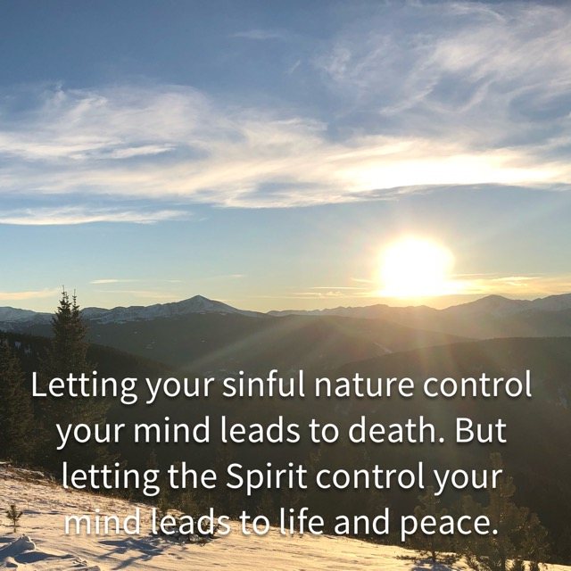 The sun over snowy mountain ridges, with the words of Romans 8:6